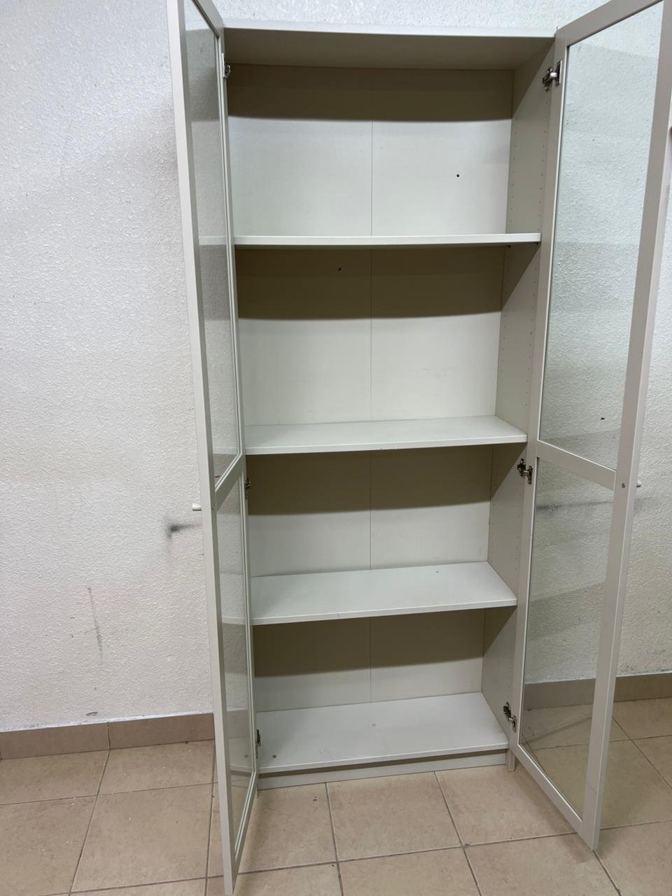 A bookcase with a glass door from IKEA, specifically from the BILLY/OXBERG series in white. - Image 4