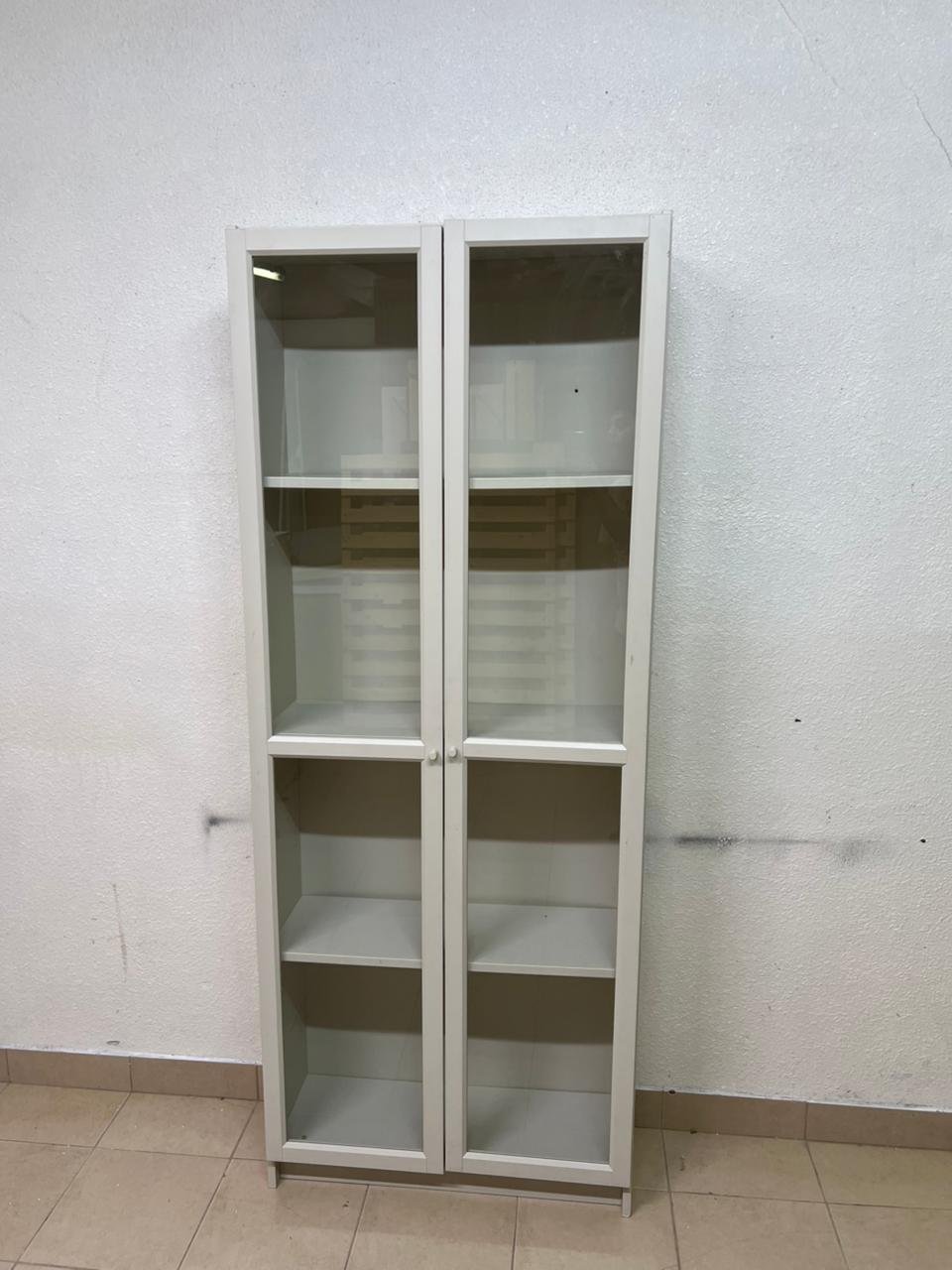 A bookcase with a glass door from IKEA, specifically from the BILLY/OXBERG series in white. - Image 5