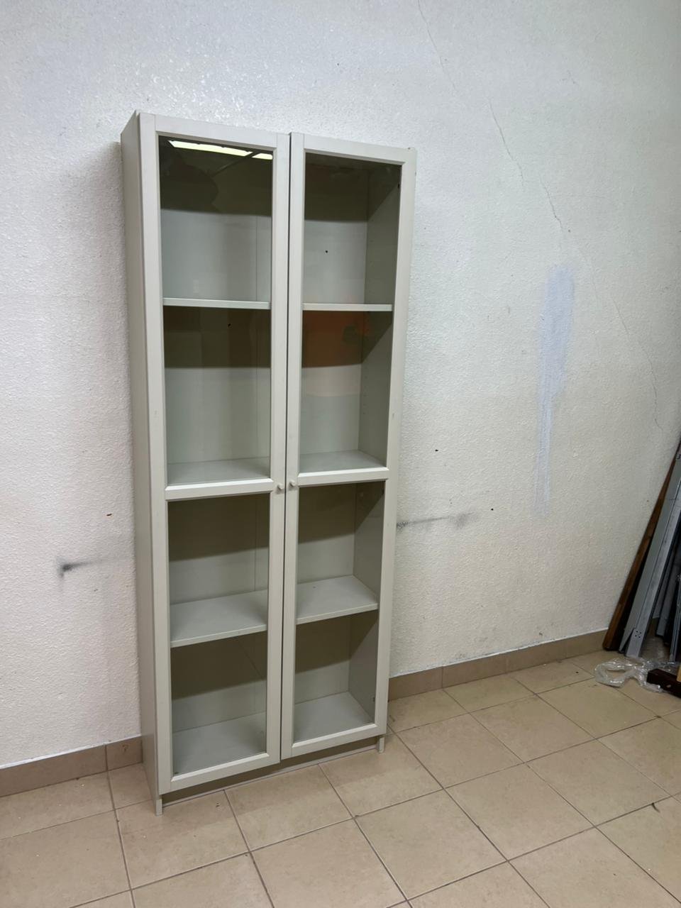 A bookcase with a glass door from IKEA, specifically from the BILLY/OXBERG series in white. - Image 7