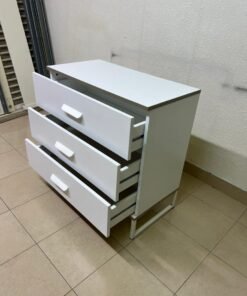 White chest of drawers with three drawers and metal legs with a connected frame. - Image 8