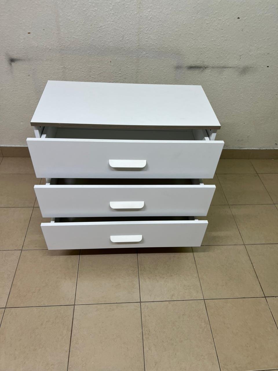 White chest of drawers with three drawers and metal legs with a connected frame. - Image 10