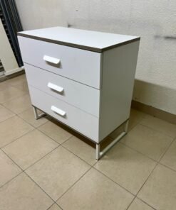 White chest of drawers with three drawers and metal legs with a connected frame. - Image 3
