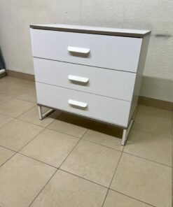 White chest of drawers with three drawers and metal legs with a connected frame. - Image 4