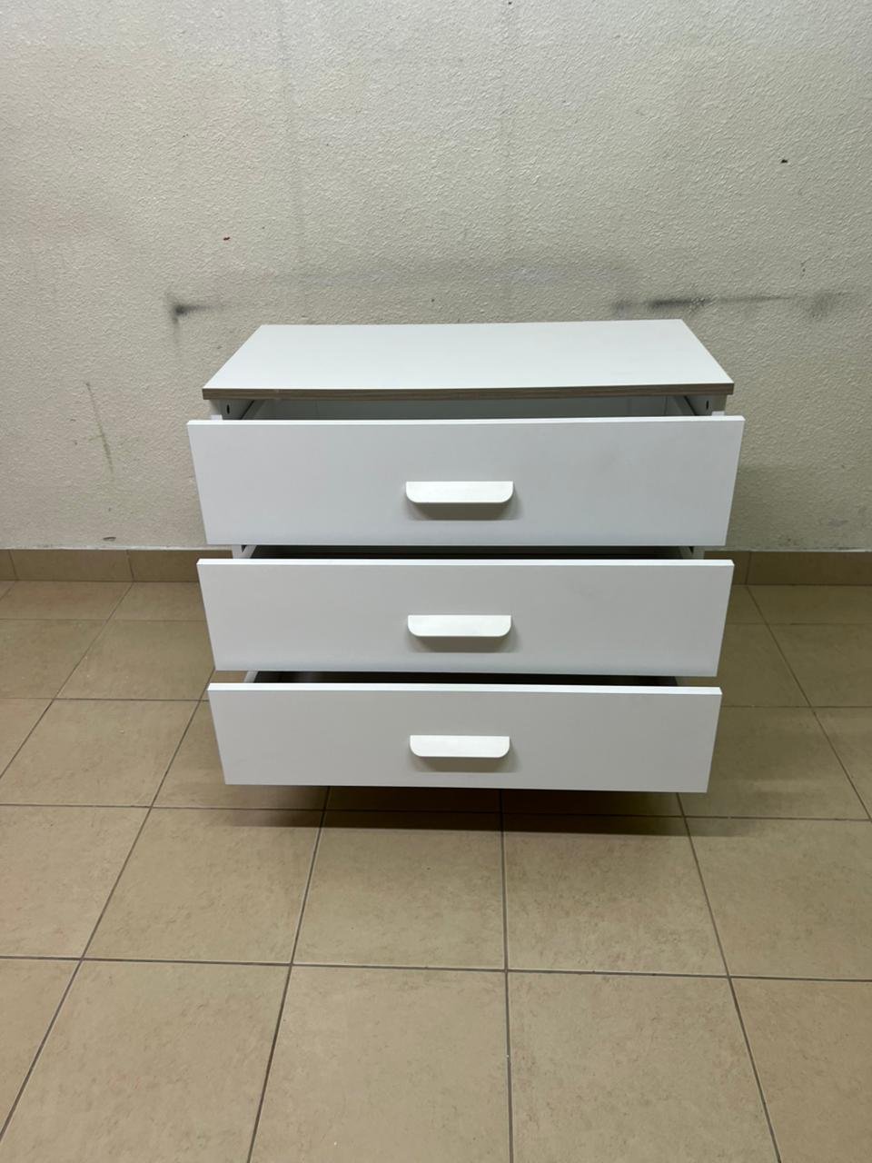 White chest of drawers with three drawers and metal legs with a connected frame. - Image 5