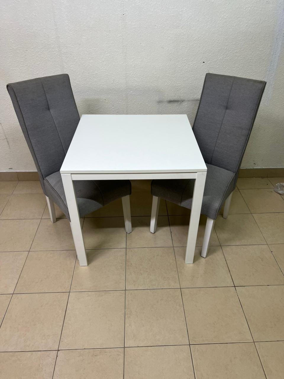 A square white dining table with two chairs - Image 6
