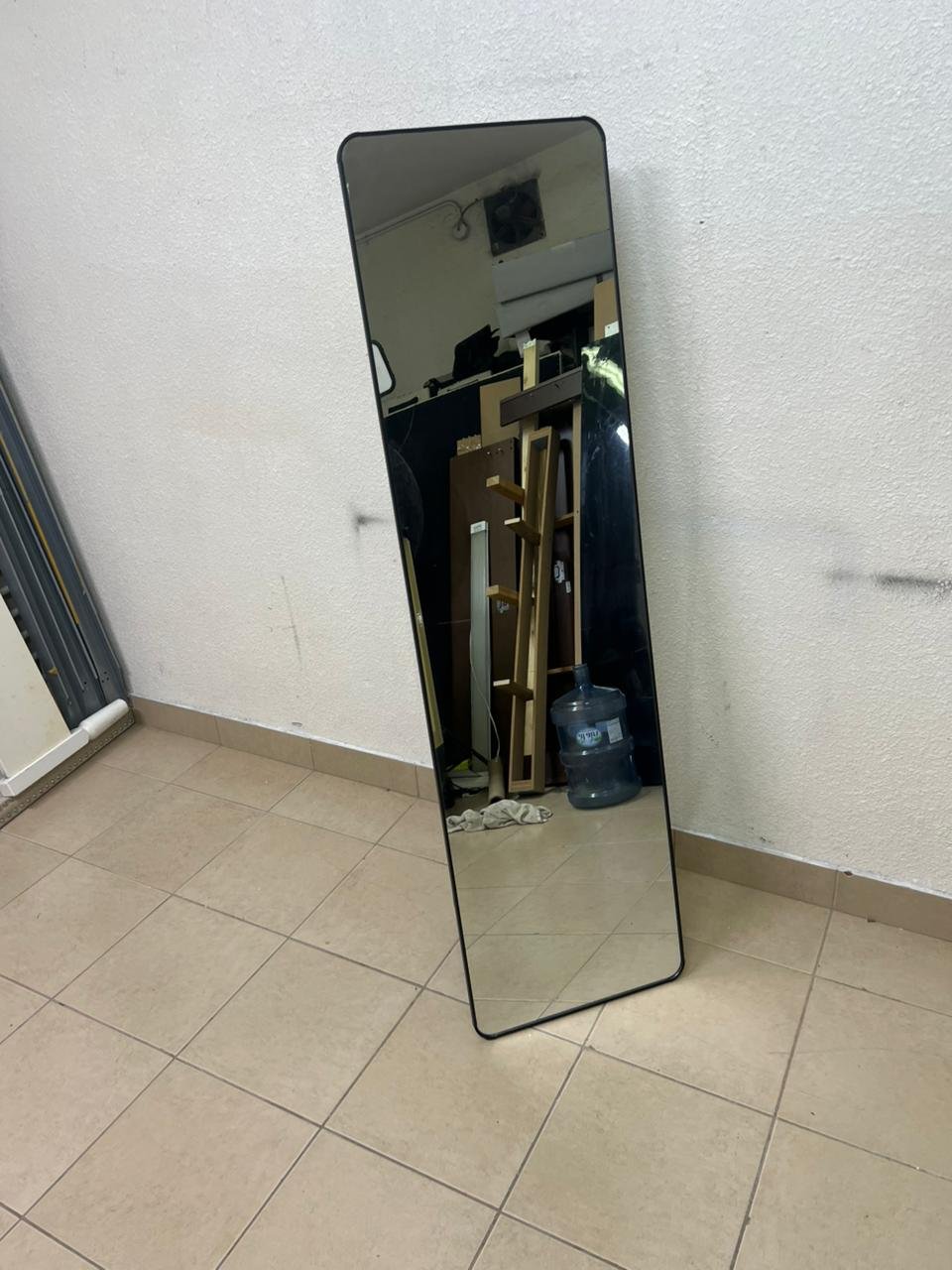 A tall, modern floor mirror featuring a slim black frame and elegant rounded corners. - Image 5
