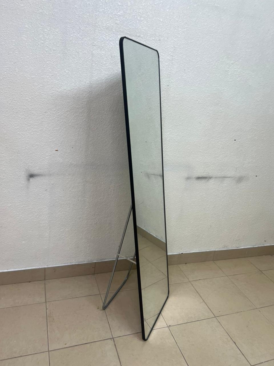 A tall, modern floor mirror featuring a slim black frame and elegant rounded corners. - Image 8