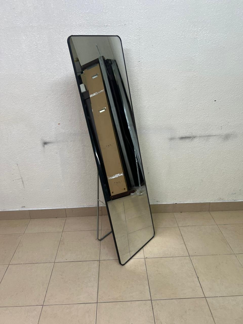 A tall, modern floor mirror featuring a slim black frame and elegant rounded corners. - Image 2