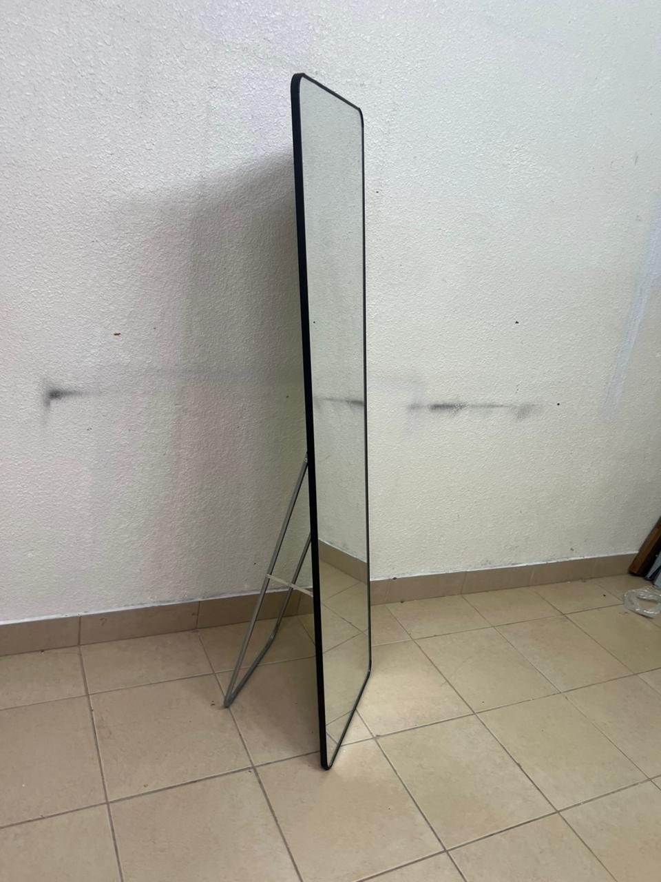 A tall, modern floor mirror featuring a slim black frame and elegant rounded corners. - Image 3