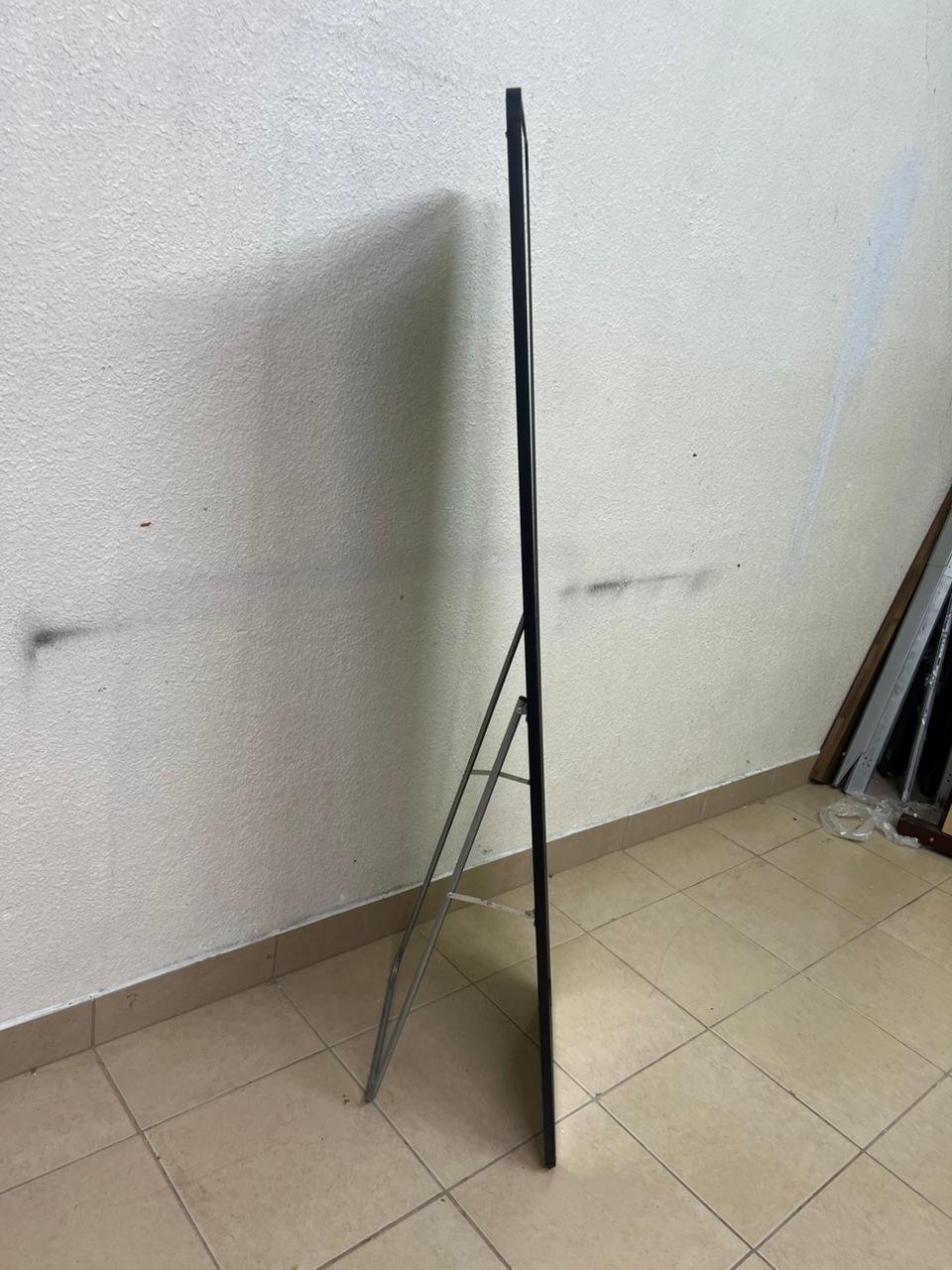 A tall, modern floor mirror featuring a slim black frame and elegant rounded corners. - Image 4
