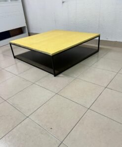 This is a square coffee table with an industrial design, featuring a black metal frame, a black pull-out drawer or lower shelf, and a light yellow wooden top. - Image 8