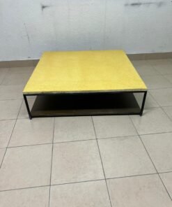 This is a square coffee table with an industrial design, featuring a black metal frame, a black pull-out drawer or lower shelf, and a light yellow wooden top. - Image 2