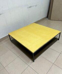 This is a square coffee table with an industrial design, featuring a black metal frame, a black pull-out drawer or lower shelf, and a light yellow wooden top. - Image 3