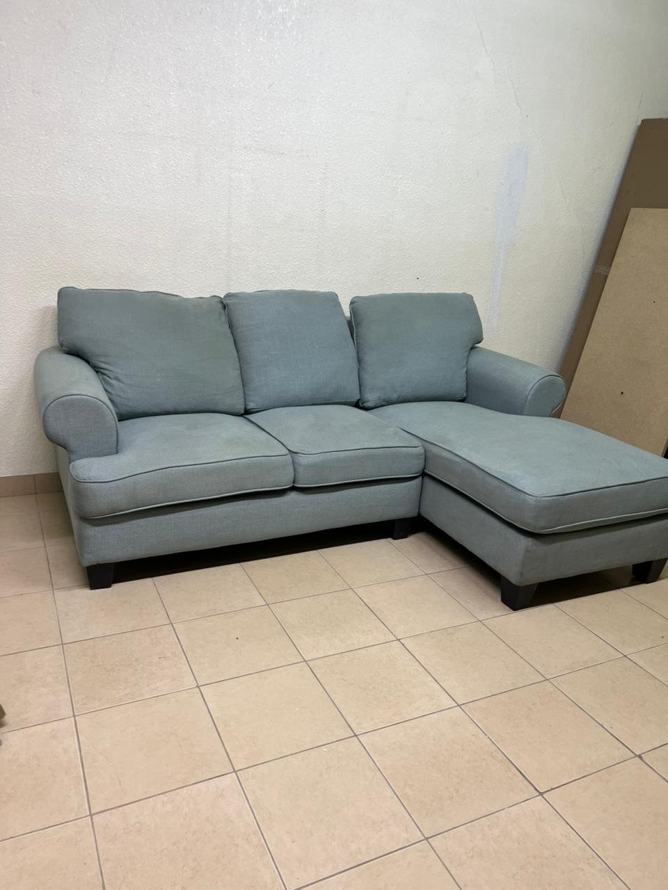 This is a light blue fabric corner sofa featuring a comfortable design with various cushions. - Image 3