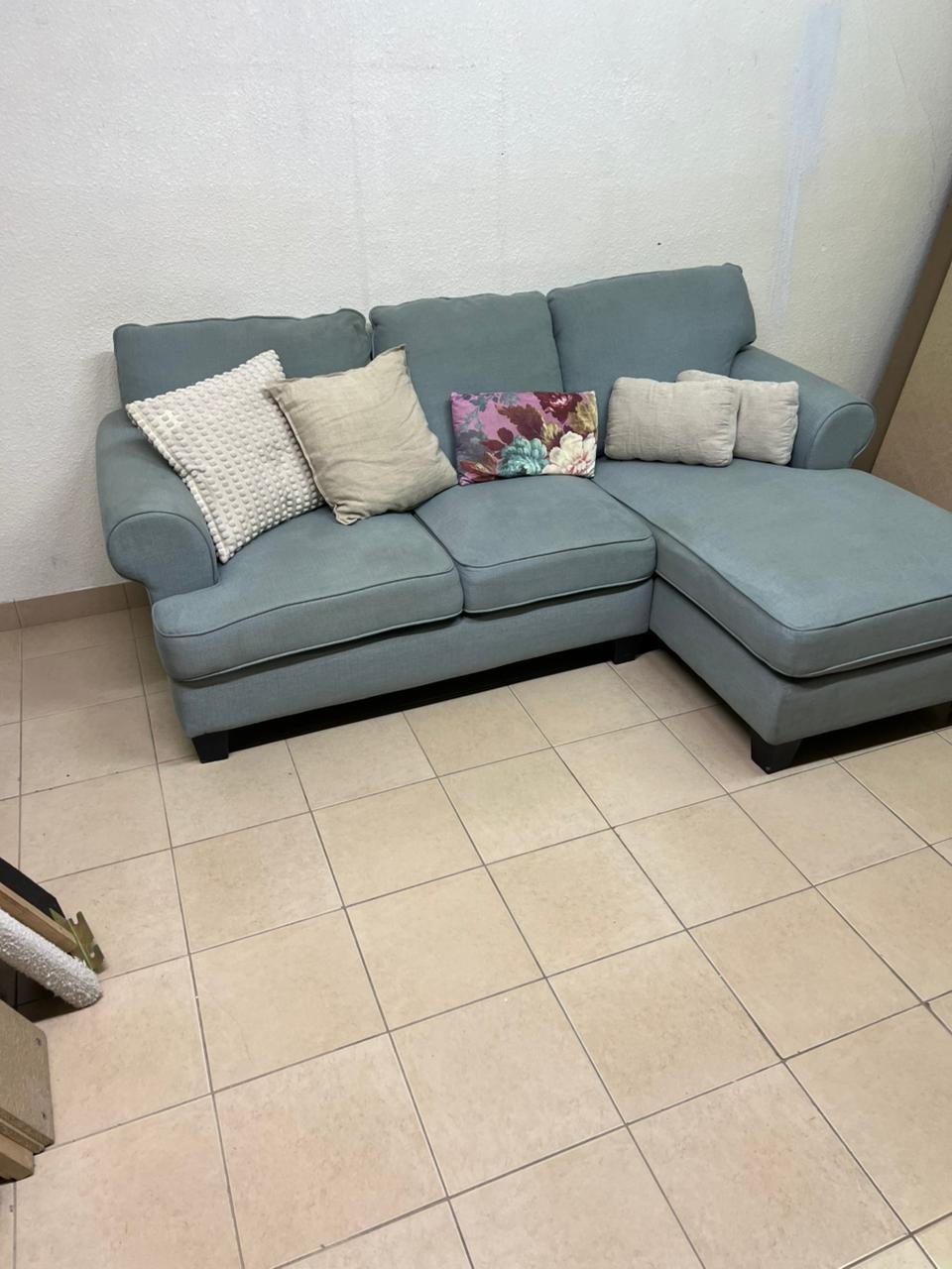 This is a light blue fabric corner sofa featuring a comfortable design with various cushions. - Image 5