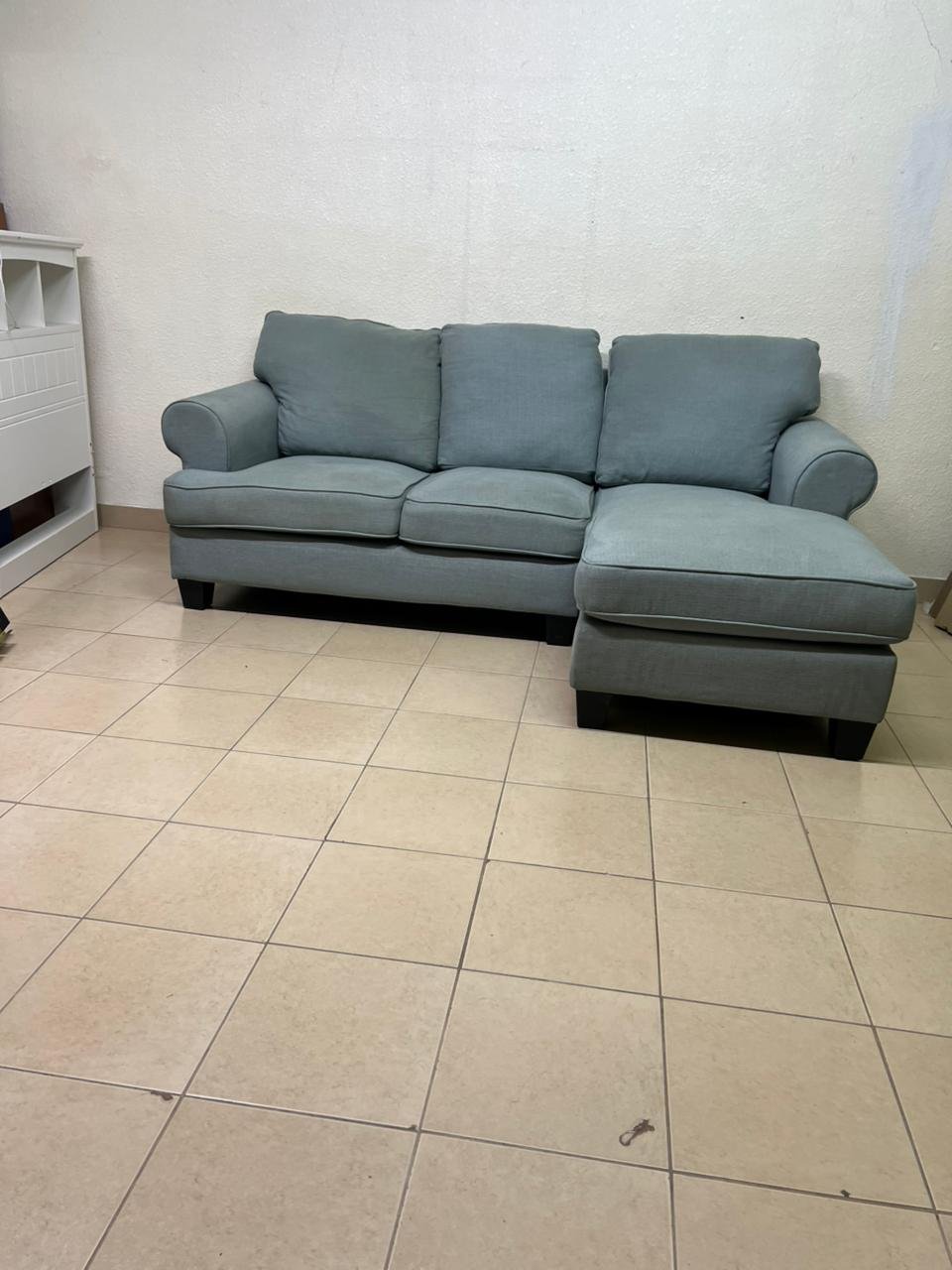 This is a light blue fabric corner sofa featuring a comfortable design with various cushions. - Image 7