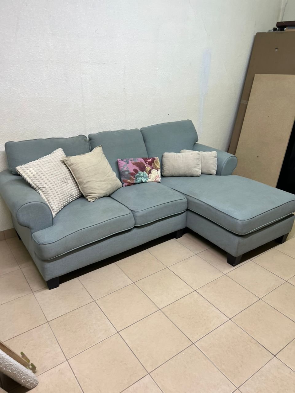 This is a light blue fabric corner sofa featuring a comfortable design with various cushions. - Image 8