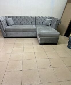 A stylish L-shaped gray sofa with internal storage space and a practical pull-out bed. - Image 5