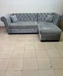 A stylish L-shaped gray sofa with internal storage space and a practical pull-out bed. - Image 6