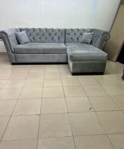 A stylish L-shaped gray sofa with internal storage space and a practical pull-out bed. - Image 2