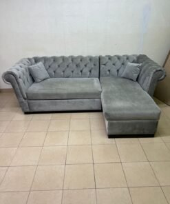 A stylish L-shaped gray sofa with internal storage space and a practical pull-out bed.