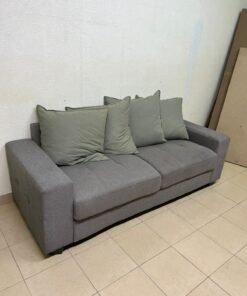 A gray fabric sofa with three seats and a rectangular design, equipped with four olive green back cushions. - Image 5