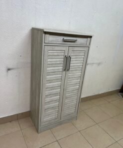 A wooden shoe cabinet (shoe rack) with a modern design in light gray or pale wood color, with two drawers or two doors with slides (slide doors) and a top handle for a small drawer. - Image 11