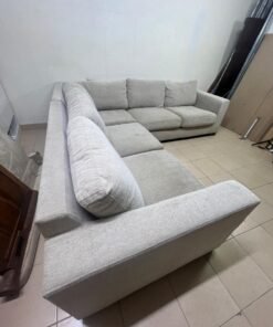 A corner sofa with a modern design (L-shaped) and upholstered in light beige or calm gray fabric. - Image 8