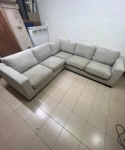 A corner sofa with a modern design (L-shaped) and upholstered in light beige or calm gray fabric. - Image 7