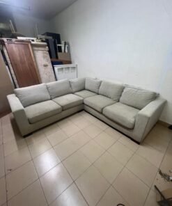 A corner sofa with a modern design (L-shaped) and upholstered in light beige or calm gray fabric. - Image 4