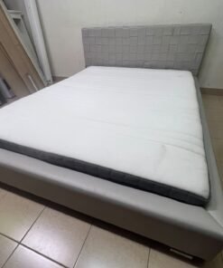 Grey double bed frame with upholstered design and distinctive headboard. - Image 3