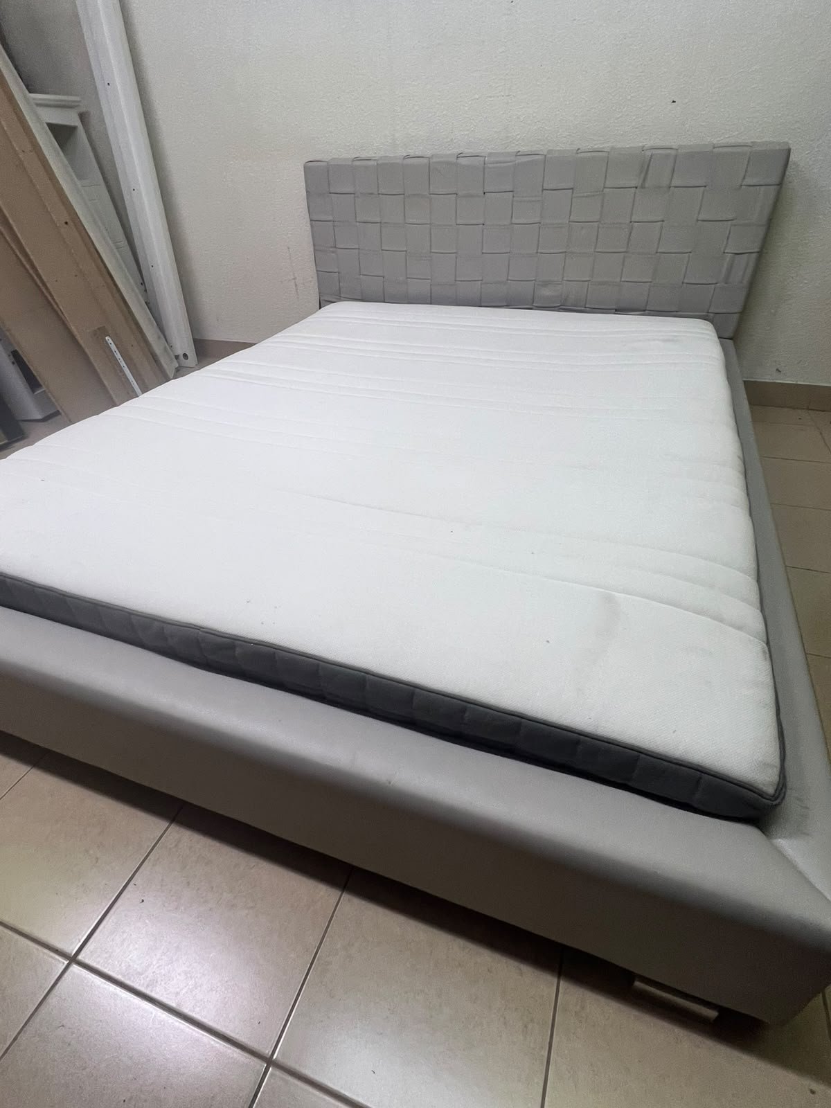Grey double bed frame with upholstered design and distinctive headboard. - Image 3