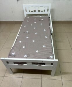 A white wooden cot, believed to be the KRITTER model from IKEA UAE, measuring approximately 70 x 160 cm, and comes with a side guard rail - Image 2