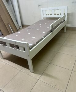 A white wooden cot, believed to be the KRITTER model from IKEA UAE, measuring approximately 70 x 160 cm, and comes with a side guard rail - Image 3