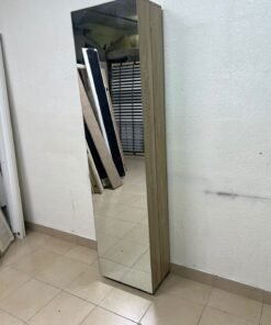 A slim shoe cabinet or wardrobe with a single door and a full-length mirror in a light oak (pine/engineered wood) wooden frame.