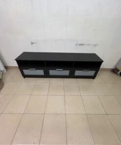 The television unit shown in the picture is a modern black TV stand with three drawers featuring opaque glass fronts and open shelves for appliances. - Image 7