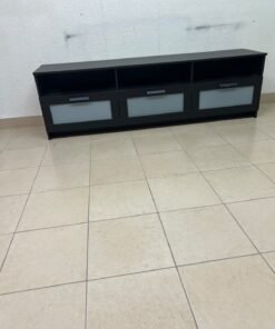 The television unit shown in the picture is a modern black TV stand with three drawers featuring opaque glass fronts and open shelves for appliances. - Image 11