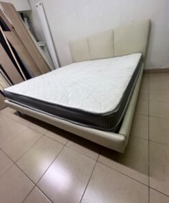 Double bed with a light beige upholstered design, featuring a split headboard and a white mattress with gray and black edges. - Image 10