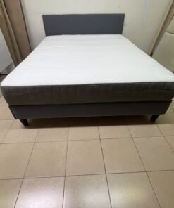 A gray upholstered bed frame with a white mattress and blanket, or a dark gray mattress on the side. - Image 5