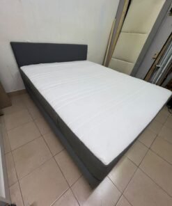 A gray upholstered bed frame with a white mattress and blanket, or a dark gray mattress on the side. - Image 8