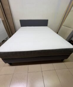 A gray upholstered bed frame with a white mattress and blanket, or a dark gray mattress on the side. - Image 12