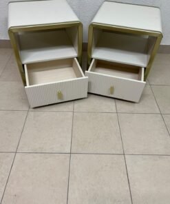 The image shows two modern bedside tables in a creamy white finish, featuring gold frames and details, as well as ribbed drawer fronts (from Home Centre). - Image 9