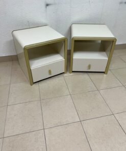 The image shows two modern bedside tables in a creamy white finish, featuring gold frames and details, as well as ribbed drawer fronts (from Home Centre). - Image 11