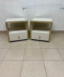 The image shows two modern bedside tables in a creamy white finish, featuring gold frames and details, as well as ribbed drawer fronts (from Home Centre). - Image 7