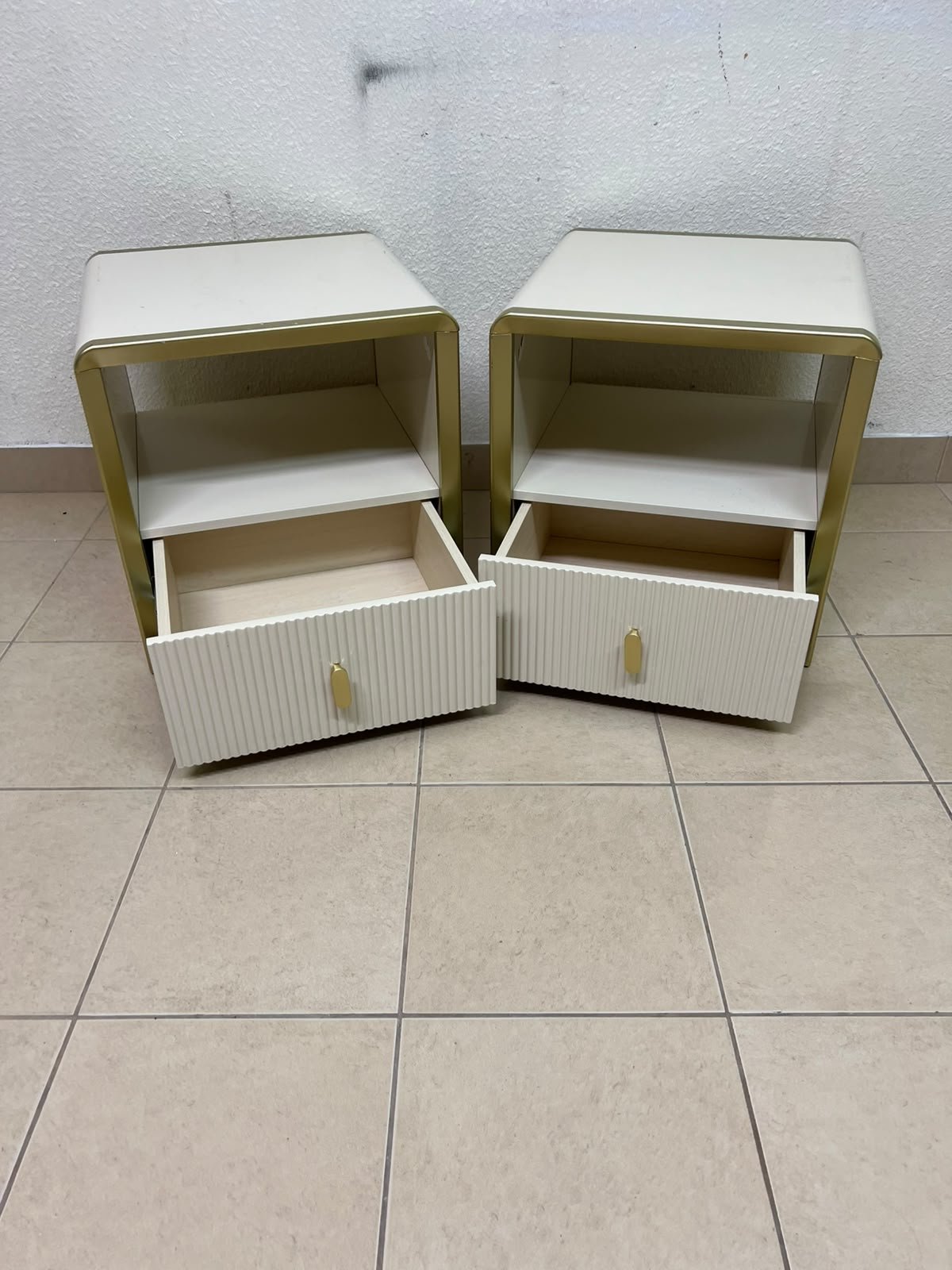 The image shows two modern bedside tables in a creamy white finish, featuring gold frames and details, as well as ribbed drawer fronts (from Home Centre). - Image 8