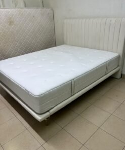 An upholstered double bed in white or light beige with a striped headboard, featuring a comfortable white mattress – Home Centre. - Image 10