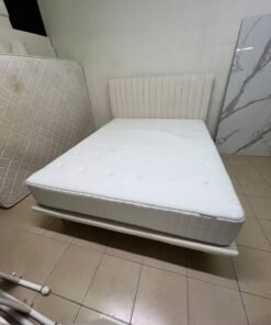 An upholstered double bed in white or light beige with a striped headboard, featuring a comfortable white mattress – Home Centre. - Image 11