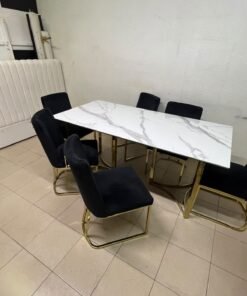 A modern six-seater dining set featuring an elegant design that combines a white marble-patterned tabletop with a gold metal base and frame, paired with black velvet chairs featuring matching gold legs. - Image 7