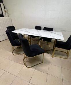 A modern six-seater dining set featuring an elegant design that combines a white marble-patterned tabletop with a gold metal base and frame, paired with black velvet chairs featuring matching gold legs. - Image 10
