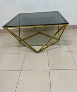 A modern, square coffee table featuring a dark or smoked glass top and a cohesive, diamond-inspired geometric base made of metal or polished gold-tone steel. - Image 7